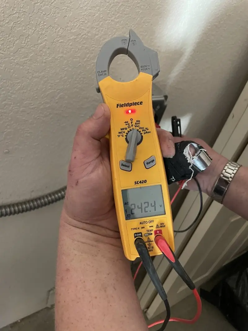 Voltage testing with clamp meter during Electrical Installation Services in Forest City